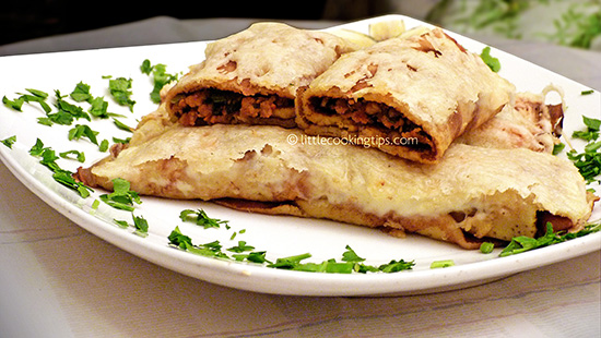 Baked crepes with ground meat and melted cheese Baked crepes with ground meat and melted cheese